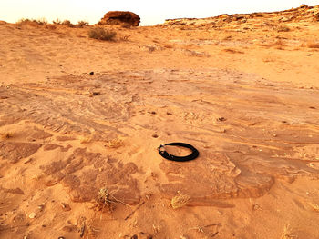 High angle view of footprints on sand