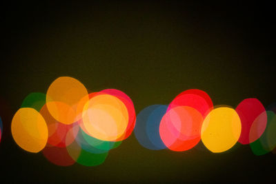 Defocused image of lights against black background