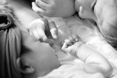 Close-up of baby sleeping with her older borther