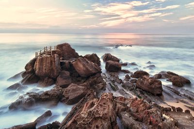 Scenic view of sea against sky at sunset