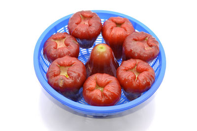 Close-up of fruit over white background