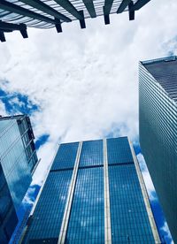 Low angle view of modern buildings against sky