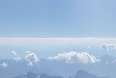 Low angle view of clouds against blue sky