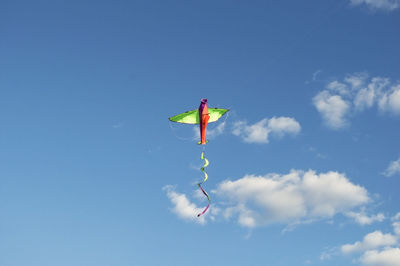 Low angle view of airshow against blue sky