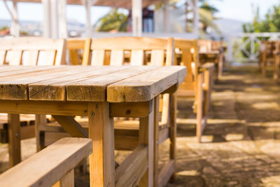 Close-up of empty chairs and table in cafe