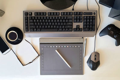 High angle view of desktop workspace with graphic design tools
