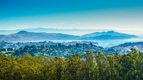 Scenic view of landscape and mountains against sky