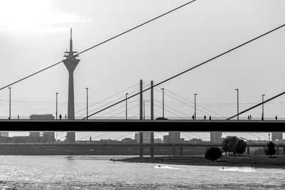 Bridge over river with communications tower in background