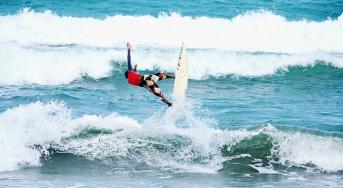 People surfing in sea