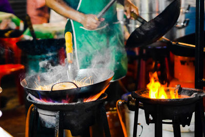 Close-up of preparing food outdoors