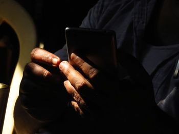 Close-up of person using mobile phone