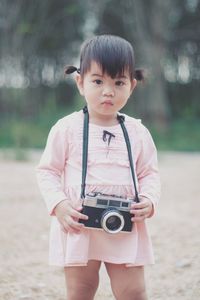Portrait of girl photographing