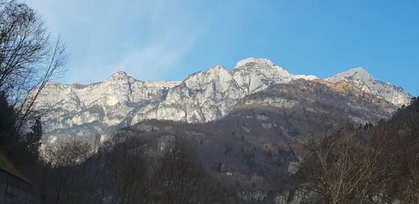 Low angle view of mountain range against sky
