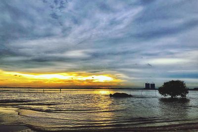 Scenic view of sea against dramatic sky