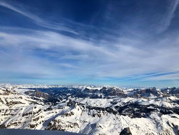 Aerial view of dramatic landscape against sky during winter