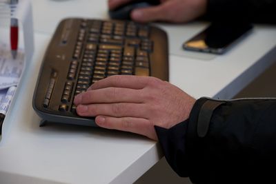 Close-up of man using smart phone