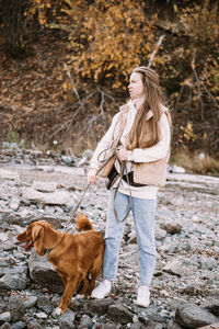 Woman with dog on the ground