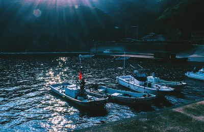 Boats in lake at night