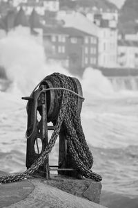 Close-up of boat in sea against sky