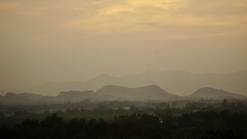 Scenic view of silhouette mountains against sky during sunset