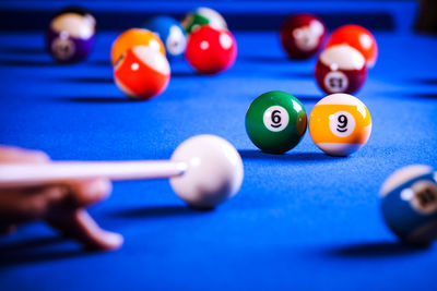 Close-up of person playing pool