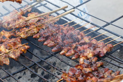 Close-up of meat on barbecue grill