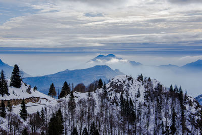 Scenic view of snowcapped mountains against sky