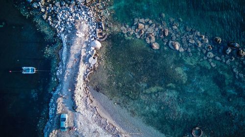 High angle view of people swimming in sea