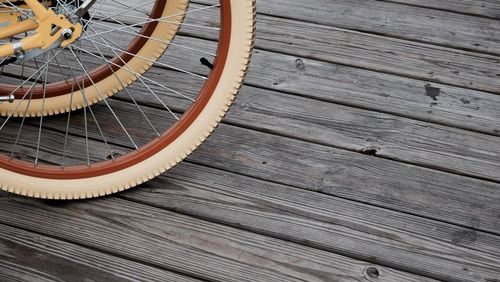 Close-up of wheels against floorboard