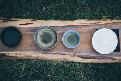 High angle view of coffee cup on grass