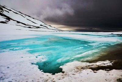 Scenic view of sea against sky during winter