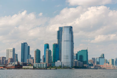 Modern buildings in city against sky