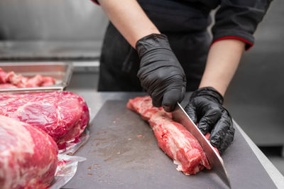 Midsection of man preparing food