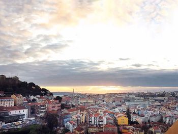 High angle shot of townscape against sky at sunset