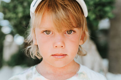 Portrait face of candid happy little kid boy of five years old with problem allergic skin