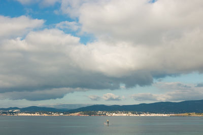 Scenic view of one person swimming in mediterranean sea against sky