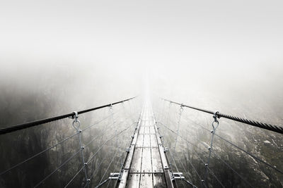 High angle view of footbridge in foggy weather