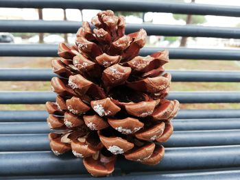 Close-up of stack on metal railing