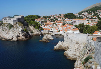 High angle view of town by sea