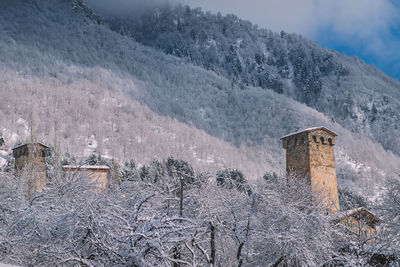 Scenic view of snow-covered mountain village