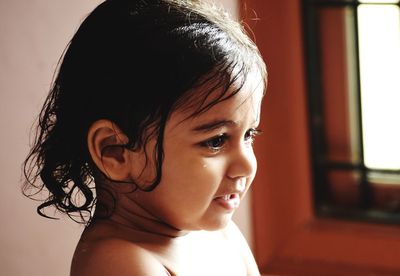 Portrait of cute boy looking away