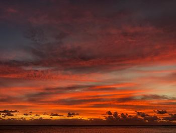 Scenic view of sea against romantic sky at sunset