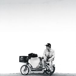 Young woman standing on railroad track