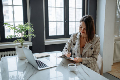 Young businesswoman working at office