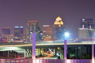 High angle view of city lit up at night