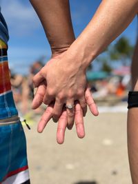 Close-up of couple holding hands
