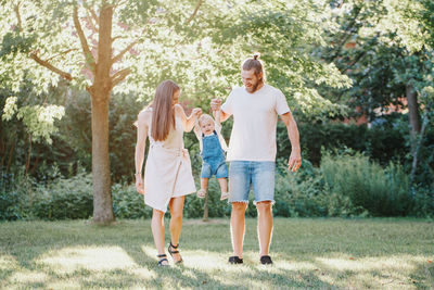 Full length of mother and daughter in park