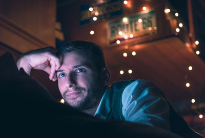 Close-up portrait of man sitting at home