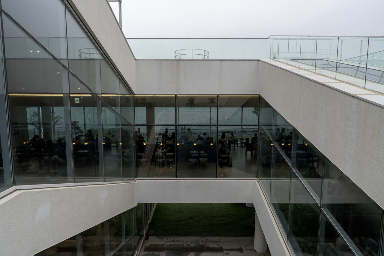 architecture, built structure, headquarters, facade, building exterior, daylighting, glass, city, reflection, building, staircase, railing, handrail, convention center, outdoors, travel, interior design, business, nature