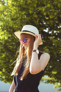 Low section of woman wearing sunglasses